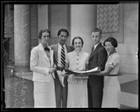 Students Patricia Hosford, Takeshi Haruki, Antoinette MaroderGlenn Cunningham, and Edith Kodama prepare to welcome Japanese students from abroad, Los Angeles, 1935