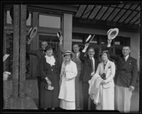 W. R. Dresslen, Mrs. W. R. Dresslen, Luther L. Mack, Mrs. Luther Mack, John E. Bauer, Mrs. John Bauer, and Frank Weller from the Lions Club raise their hats as they leave for Mexico, Los Angeles, 1935