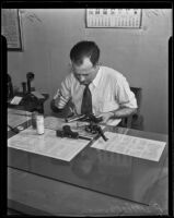 P. D. Ackerman, fingerprinting a gun from the Julia Graham suicide case, Los Angeles, 1935