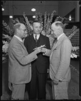 J. B. Van Nuys, J. F. Bourne, and H. B. R. Briggs inside new post office, Los Angeles, 1935