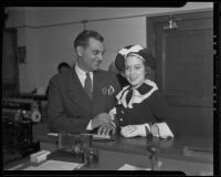 Hallam Cooley and Doris MacMahon receive their wedding license, Los Angeles, 1935