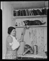 Mrs. Rheta Lorraine Gum and dog Nip rid storeroom of black widows, Los Angeles, 1935