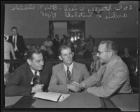 Otis T. Shields and attorney, Stanley Visel and Archie Mitchell, in court for Shields murder trial, 1935