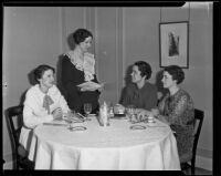 Lucille Schneiders, Mary Fitzgerald, Loretta Mangan, and Francis Boyle, members of the Young Ladies' Institute, have luncheon at the Biltmore, Los Angeles, 1935