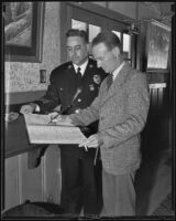 Australian pilot Sir Charles Edward Kingsford-Smith with Chief of police James E. Davis, Los Angeles, 1935