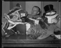 George Champlain working the lost and found booth at the California Pacific International Exposition, San Diego, 1935