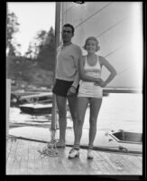 Paul Johansing and Virginia Chatterton stand in front of his sailboat, Lake Arrowhead, 1935