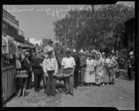 Sheriff Gene Biscailuz and Mexican Consul Ricardo Hill pose with locals during the Founding Day Celebration at Olvera Street, Los Angeles, 1935