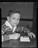 Kenyon Sills, son of actress Doris Kenyon, preparing to go to London, Los Angeles, 1935