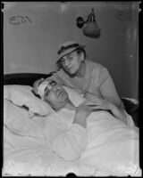 Busby Berkeley, film and dance director, being comforted by his mother, Gertrude B. Enos, after a car accident, Los Angeles, 1935