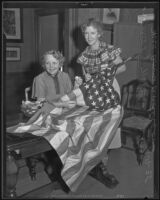 Ann Anderson and Mrs. L. J. Nelsen repair the American flag, Los Angeles, 1935