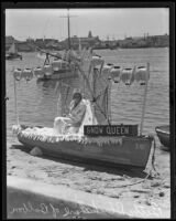 Hoxsie Smith with her boat, Betty Blackshare, in the Tournament of Lights, Balboa peninsula (Newport Beach), 1935