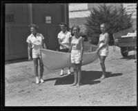 Barbara Murphy, June Murphy, Pat Ridgway, and Betty Ridgway carry their boat, Newport-Balboa, 1935
