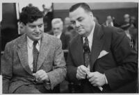 Joseph Fainer and David Hutton sit together during the Rheba Crawford libel suit, Los Angeles, 1935
