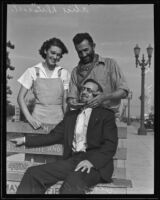 Alice Driscoll watches Al Mauch comb George Archer’s beard, Maywood, 1935