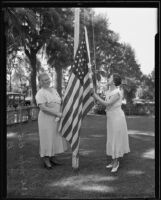 Mrs. B. L. Goodhart and Mrs. B. O.  Holbrook raise the American flag, Los Angeles, 1935
