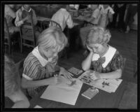 Ingrid Hanson and Marilyn Hensen drawing on the first day back to school, Montebello, 1935