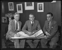 William Arthur Newman, district engineer, W. E. Reynolds, assistant director of public works, and Alfred Cohn, collector of customs, discussing new post office building plans, Los Angeles, 1935