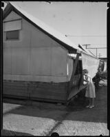 Eastman Grammar School student Phyllis Dayley looking into a classroom, Los Angeles, 1935