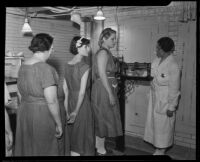 Chief jail matron Vada Sullivan weighing incarcerated women, Los Angeles, 1935