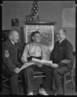 William R. Sanderson, Robert C. Powers and P.H. Milot sitting down talking, Los Angeles, 1935