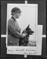 Lou Henry Hoover pets a dog, 1935