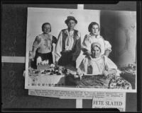M. Z. Svovoda, Ludevit Zelenay, Jr., Etl Kristofek, and Paula Kristofek prepare for exhibition, Los Angeles, 1935