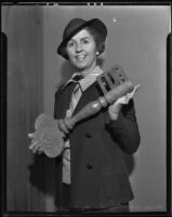 Dorothy E. Bunnell holding redwood key presented to FDR by California Redwood Association, San Diego, 1935