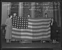 Five women demonstrate how to properly display the US Flag, 1935