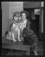 Patricia Douglas poses with a dog named Balto, [Los Angeles?], 1935