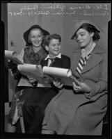 Diana Gibson, Billy Burrud, and Marion Bell sign film contracts, Los Angeles, 1935