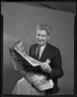 Doug Douglas poses with newspaper comic strips, Los Angeles, 1935