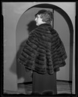 Woman models fur cape at the Times' fashion show, Los Angeles, 1935