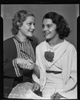 Young actresses Betty Burgess and Olympe Bradna shake hands, Los Angeles, 1935