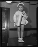 Four-year-old child actress Darla Hood with studio contract and pen, Los Angeles, 1935