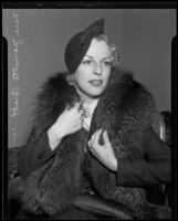 Profile image of seated Mrs. Jeanette Brott, court witness to business suit, Los Angeles, 1935