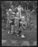 Mary Jane Clary, Bobbie Harrell, Guy De Wolf, and Crete De Wolf in their Halloween costumes, Los Angeles, 1935