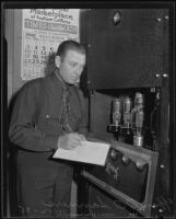 Officer Orley O. Sanner listens to police radio, Los Angeles, 1935