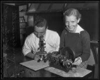 Mario Acquarelli and Doris Roberts pose with science equipment, Los Angeles, 1935