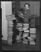 Virginia Hudson and stacks of books, Los Angeles, 1935