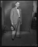 Ed Herman standing with hat, Los Angeles