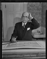 Pioneer Designer John B. Holtzclaw inspecting new drawings, Los Angeles, 1935