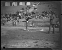 Athlete Bud Houser throwing a discus at the Coliseum, Los Angeles, 1922-1926