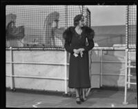 Barbara Hutton on a ship holding gloves, San Pedro (Los Angeles), 1930s