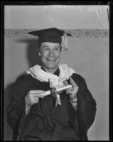 Actor Joe E. Brown with graduation robes and diploma, Los Angeles, circa 1930
