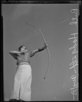 Ruth Hodgert taking aim at National Archery Association annual meeting, Los Angeles, 1935
