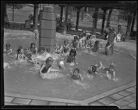 A group of children splash in a fountain, Echo Park, 1935