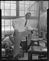 Paul Sample working on a painting in his studio, Pasadena, circa 1935