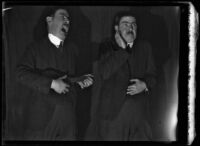 Vaudeville (?) act with two men in front of a stage curtain, 1920-1939