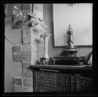 Asian vase and statue on a bookcase, photographed by Olive Percival, 1898-1944